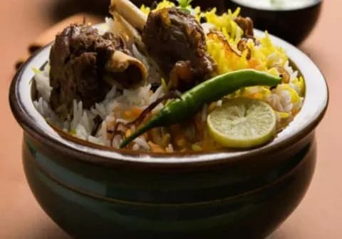Full Mutton Biryani Double Ghosh - Cafe 555, Hyderabad